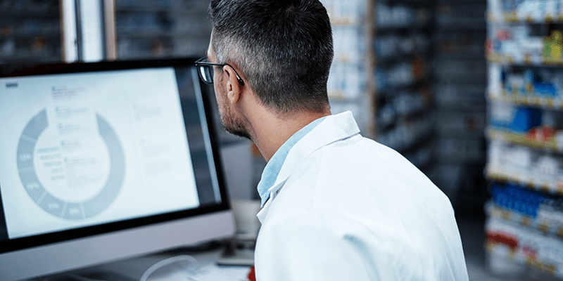 Man on computer in lab setting