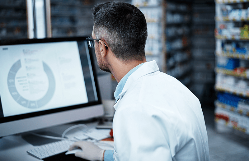 Man on computer in lab setting