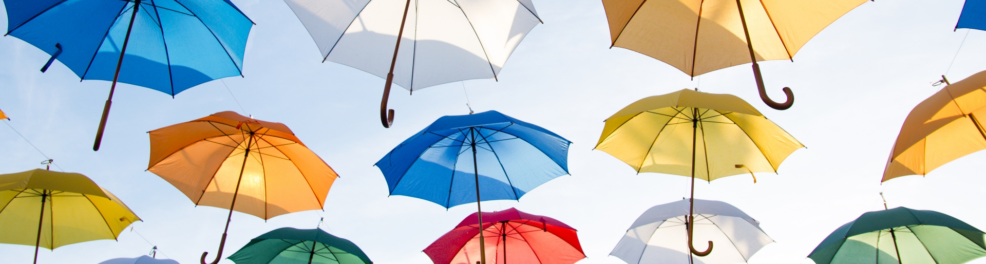 umbrellas hanging from wires